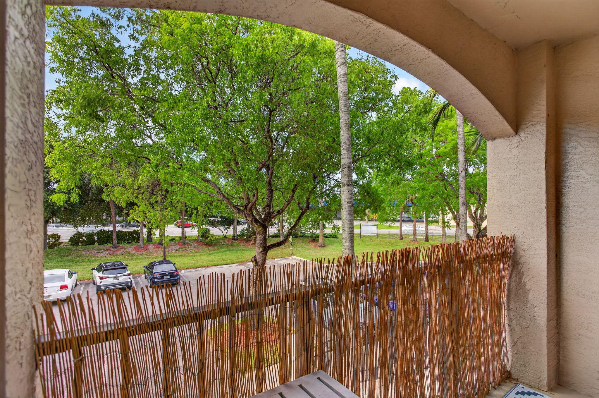 5880 West Sample Road, Unit 206 Coral Springs, FL 33067 - Photo 23 of 37 a view of green field with trees in the background