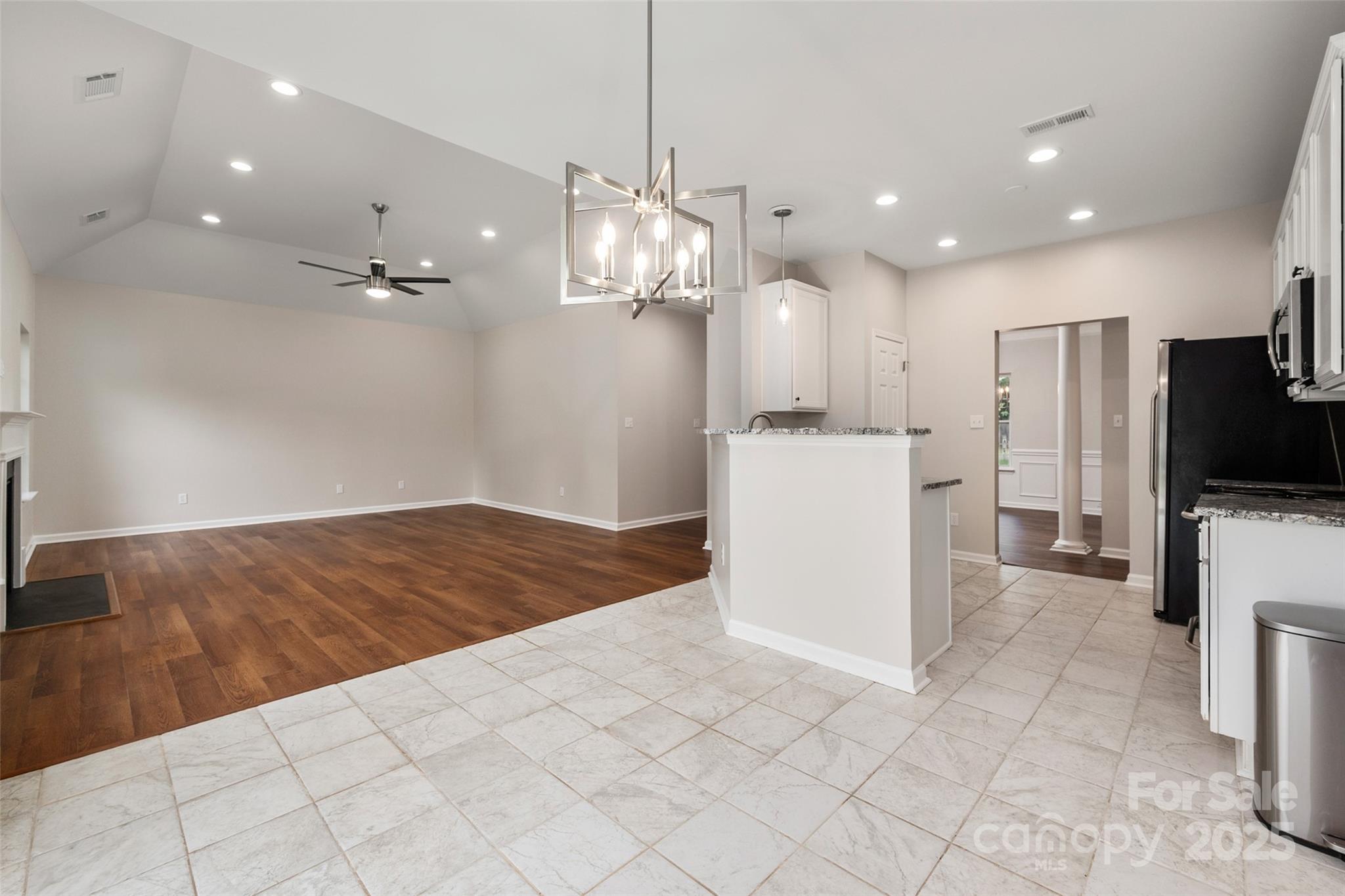 1004 Toquima Trail Monroe, NC 28110 - Photo 11 of 38 a view of a kitchen with refrigerator and microwave