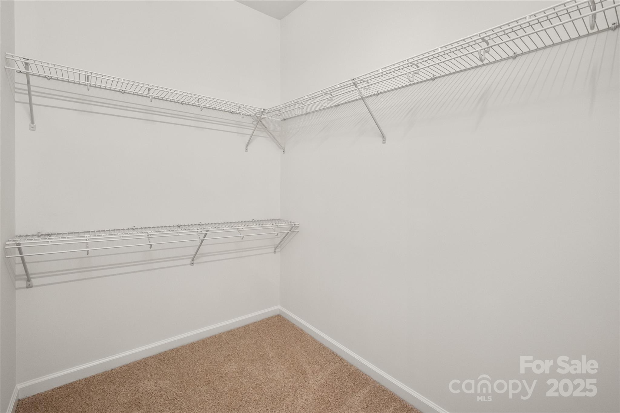 1004 Toquima Trail Monroe, NC 28110 - Photo 22 of 38 a view of a room with racks on the wall