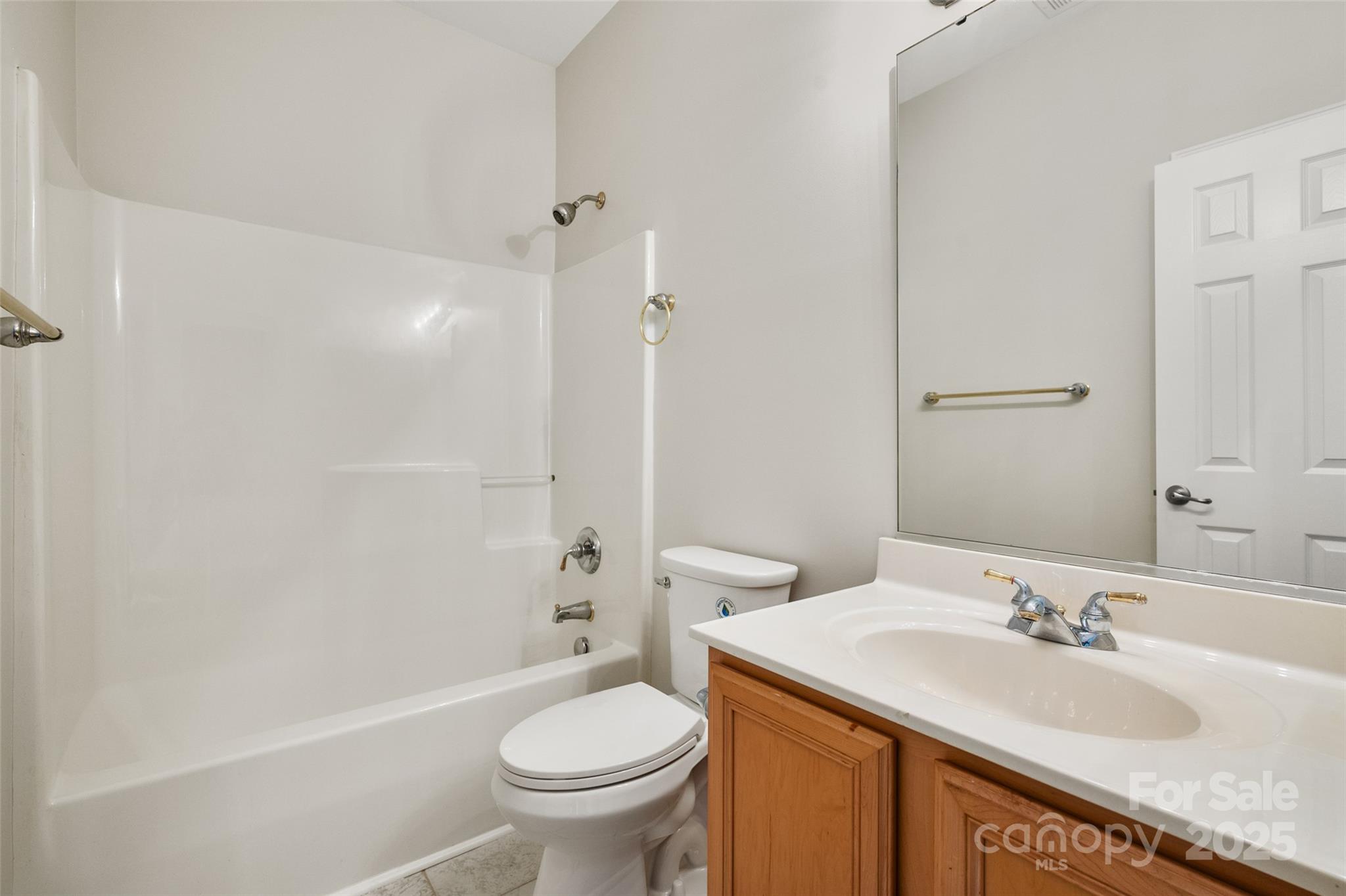 1004 Toquima Trail Monroe, NC 28110 - Photo 27 of 38 a bathroom with a granite countertop sink toilet and shower