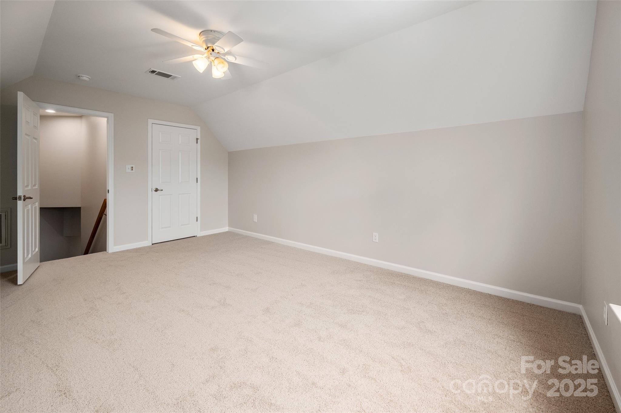 1004 Toquima Trail Monroe, NC 28110 - Photo 29 of 38 an empty room with a ceiling fan and a window