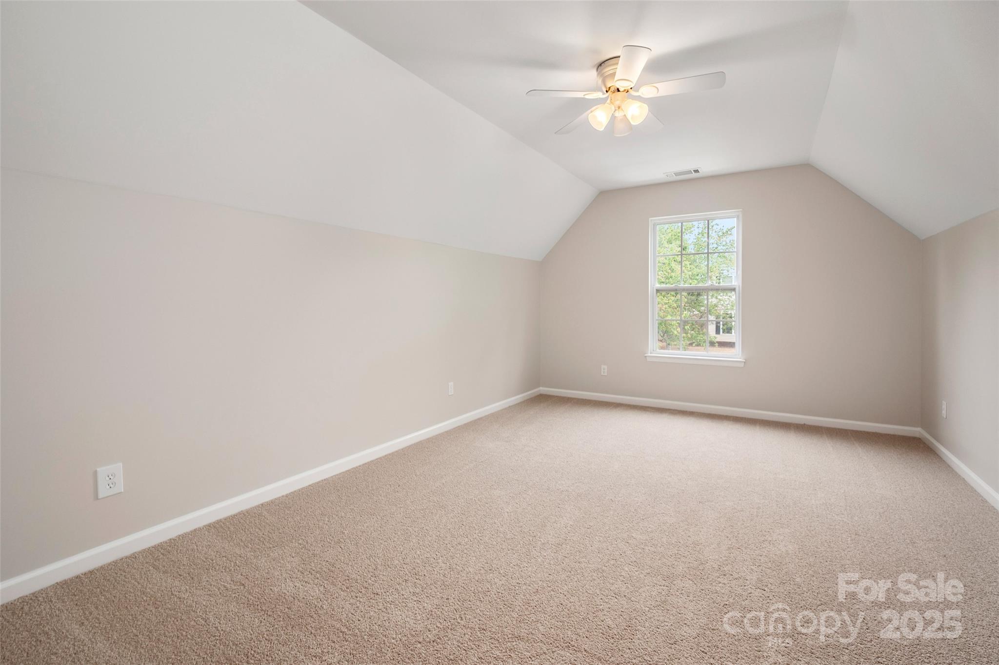 1004 Toquima Trail Monroe, NC 28110 - Photo 30 of 38 an empty room with a window and a fan