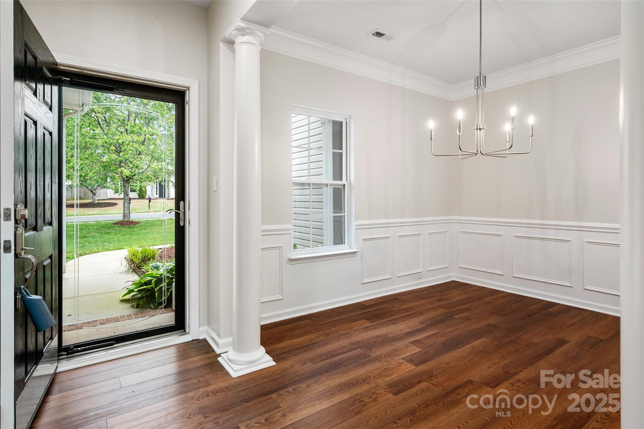 1004 Toquima Trail Monroe, NC 28110 - Photo 3 of 38 a view of an empty room with wooden floor and a window