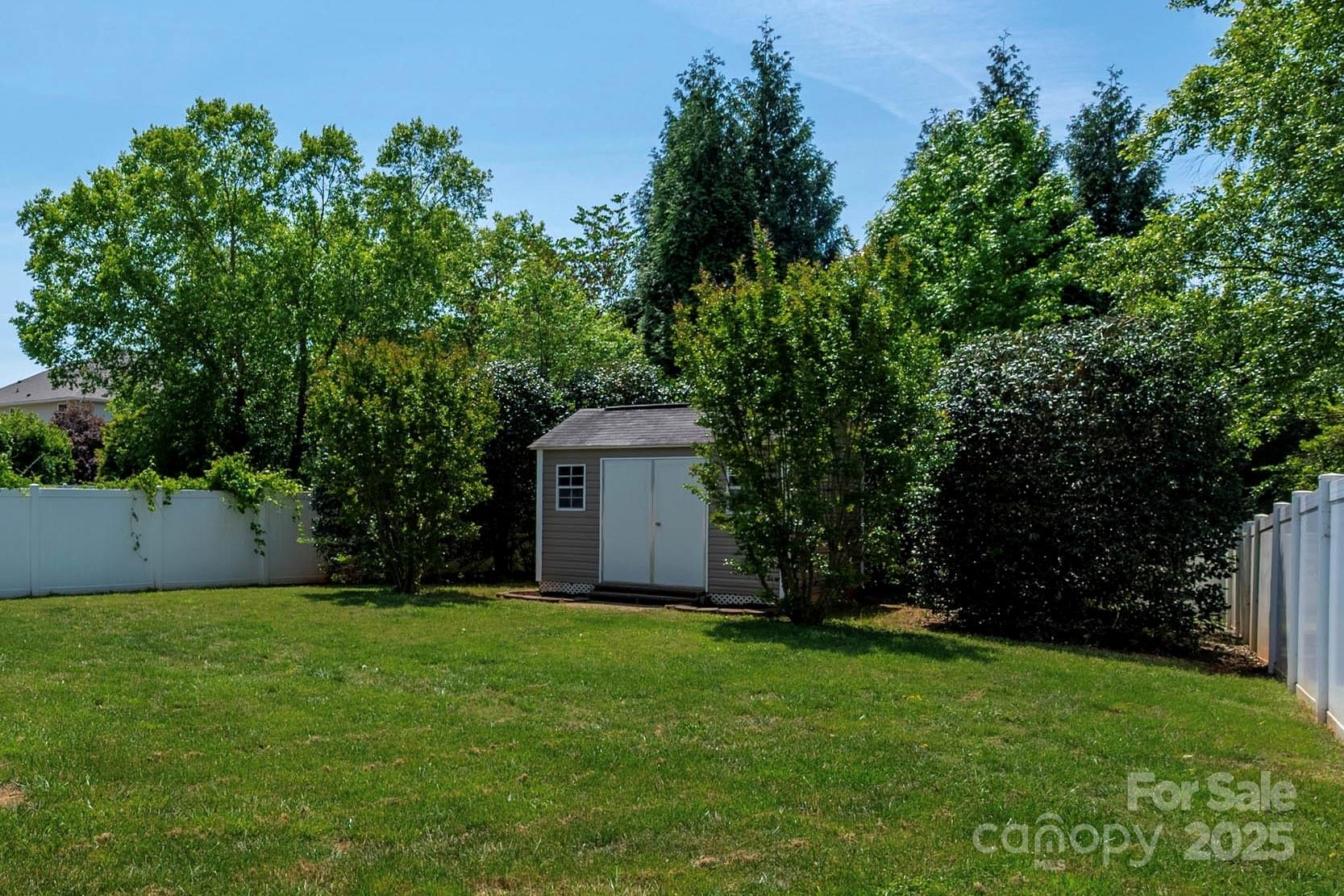 1004 Toquima Trail Monroe, NC 28110 - Photo 32 of 38 a view of an house with backyard space and garden