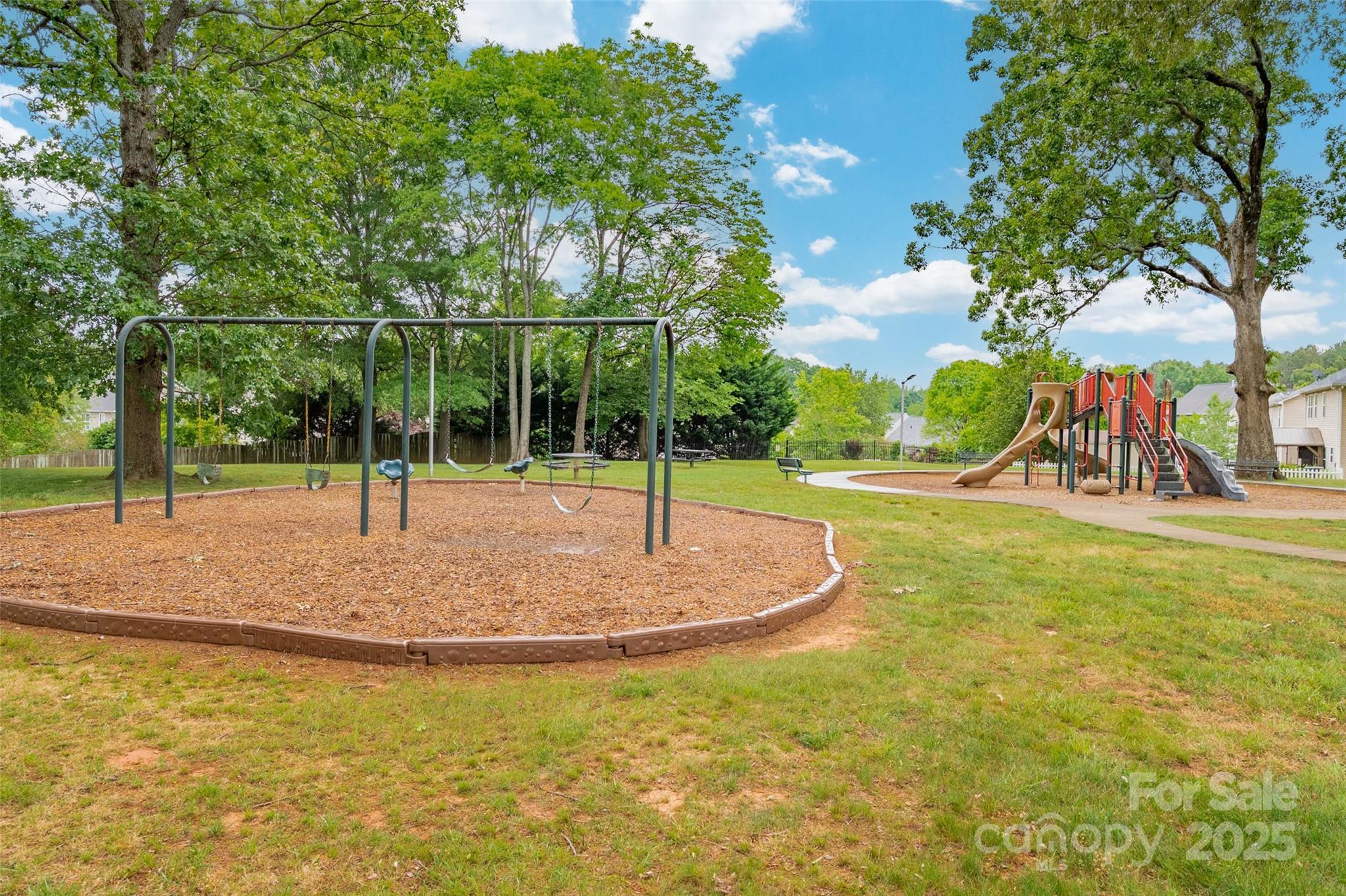 1004 Toquima Trail Monroe, NC 28110 - Photo 36 of 38 a backyard of a house with table and chairs