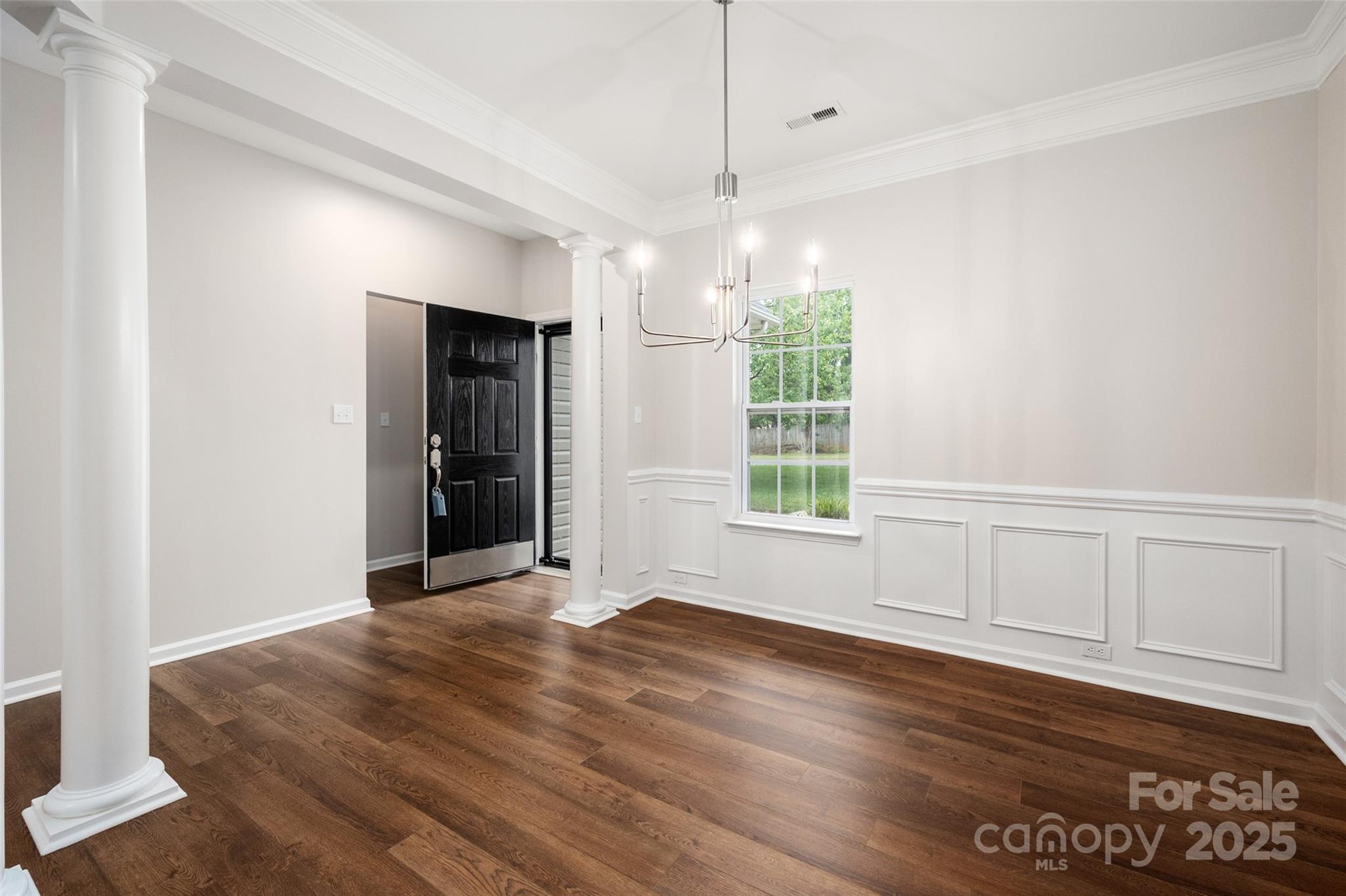 1004 Toquima Trail Monroe, NC 28110 - Photo 5 of 38 an empty room with wooden floor and windows