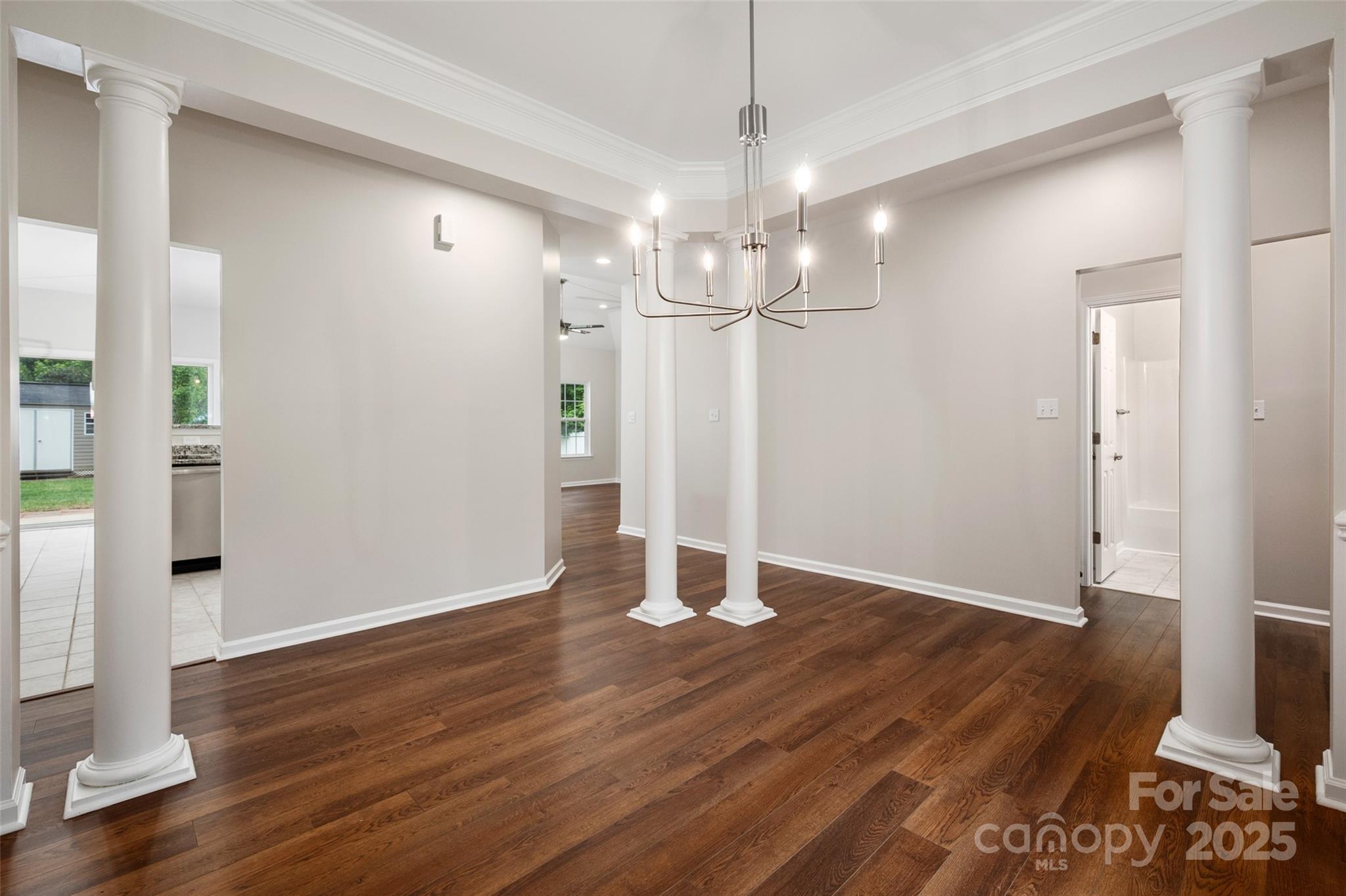 1004 Toquima Trail Monroe, NC 28110 - Photo 6 of 38 a view of an empty room with wooden floor