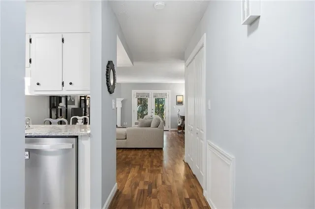 a view of living room with furniture and wooden floor