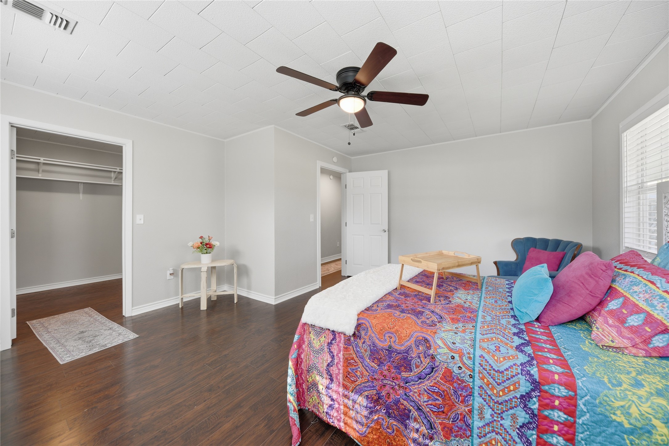 1702 Rampart Street Columbus, TX 78934 - Photo 12 of 38 a bedroom with a bed and a book shelf