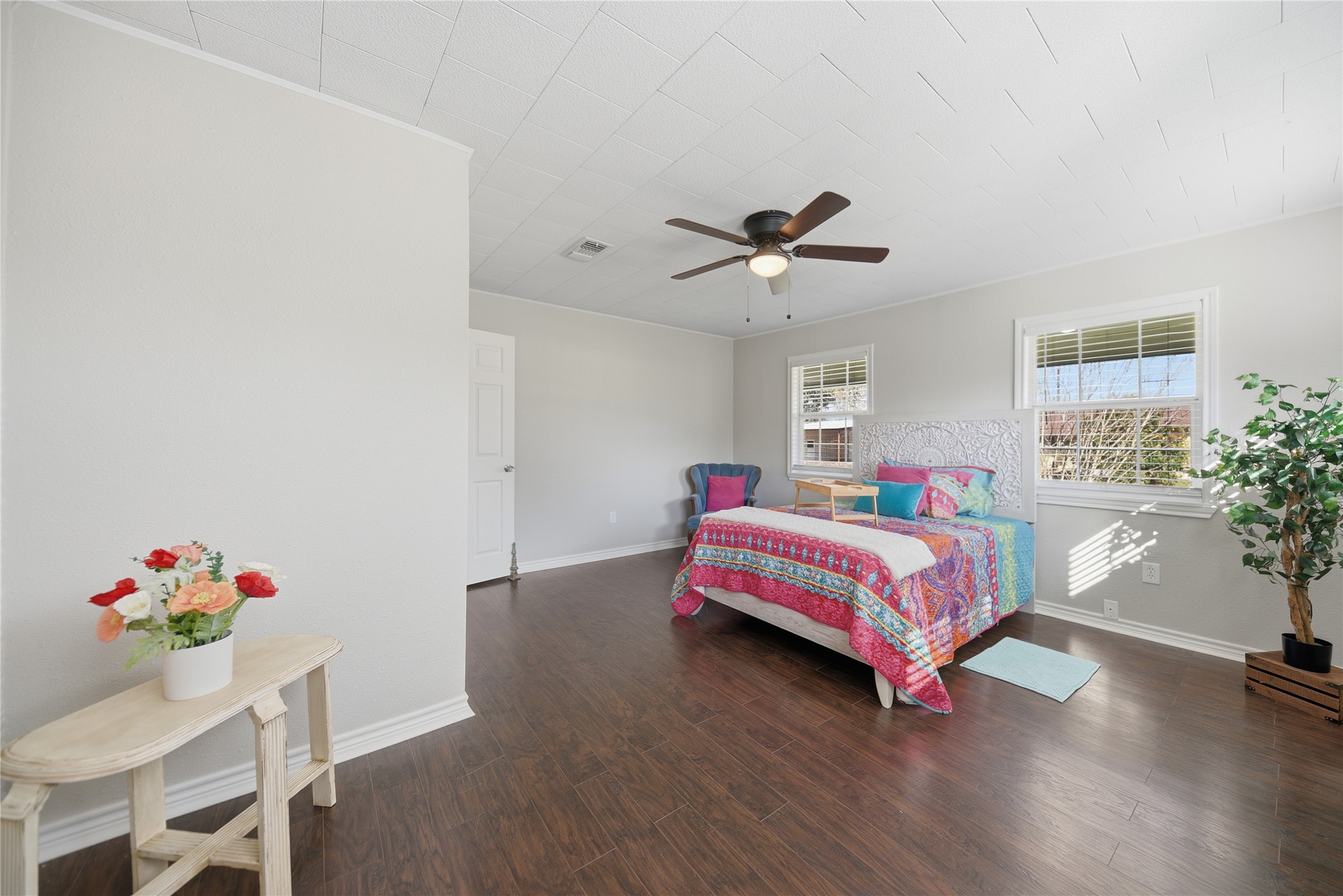 1702 Rampart Street Columbus, TX 78934 - Photo 14 of 38 a bedroom with a bed and wooden floor