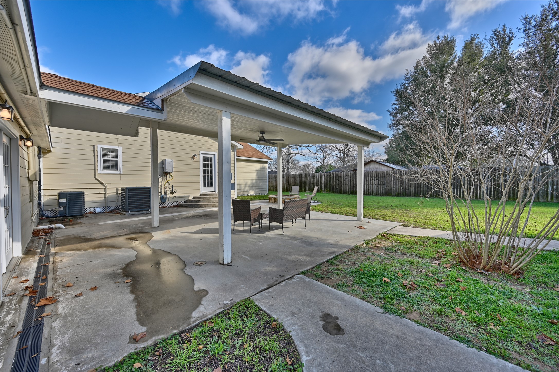 1702 Rampart Street Columbus, TX 78934 - Photo 22 of 38 a view of a house with backyard and porch