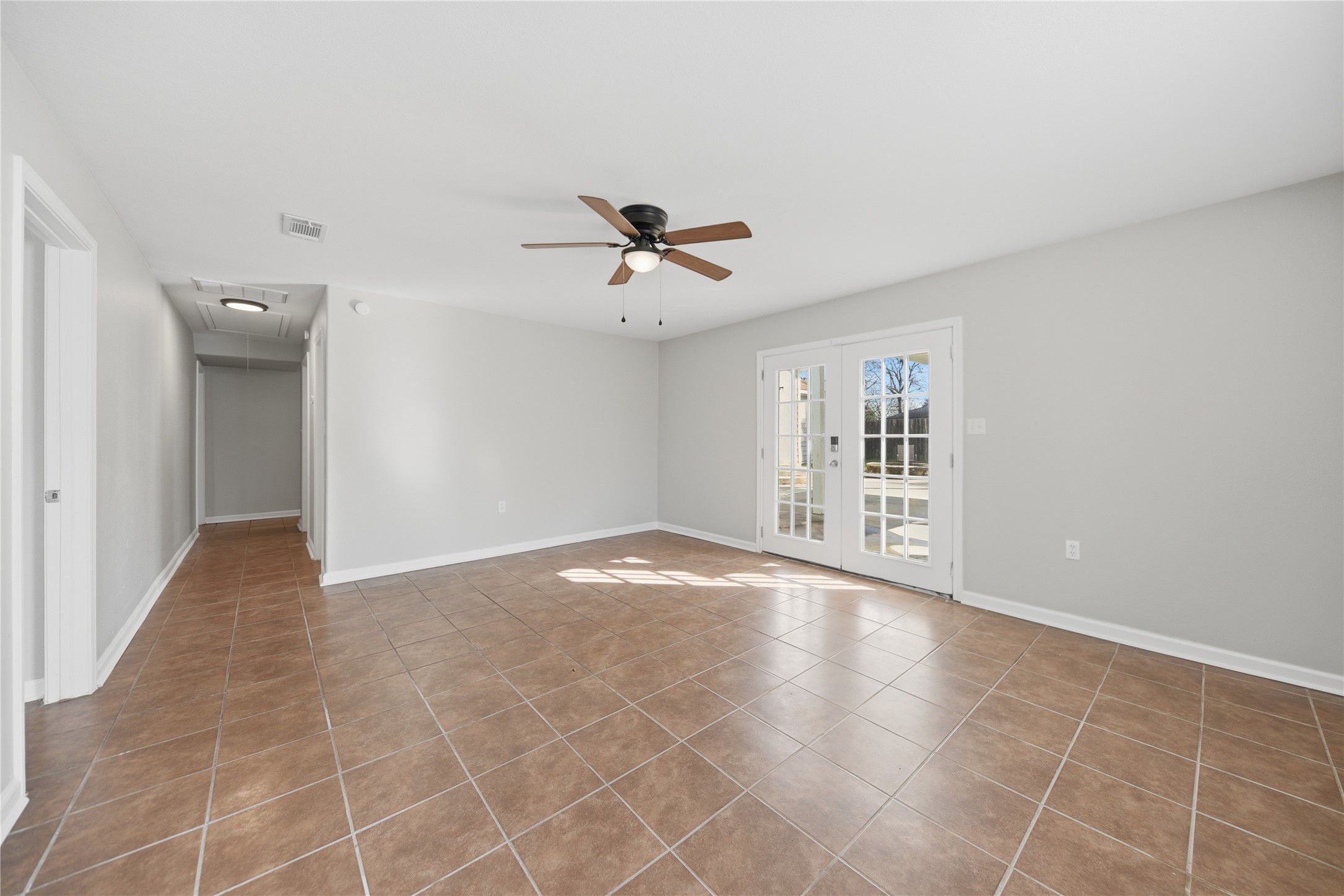 1702 Rampart Street Columbus, TX 78934 - Photo 24 of 38 wooden floor in an empty room with a window