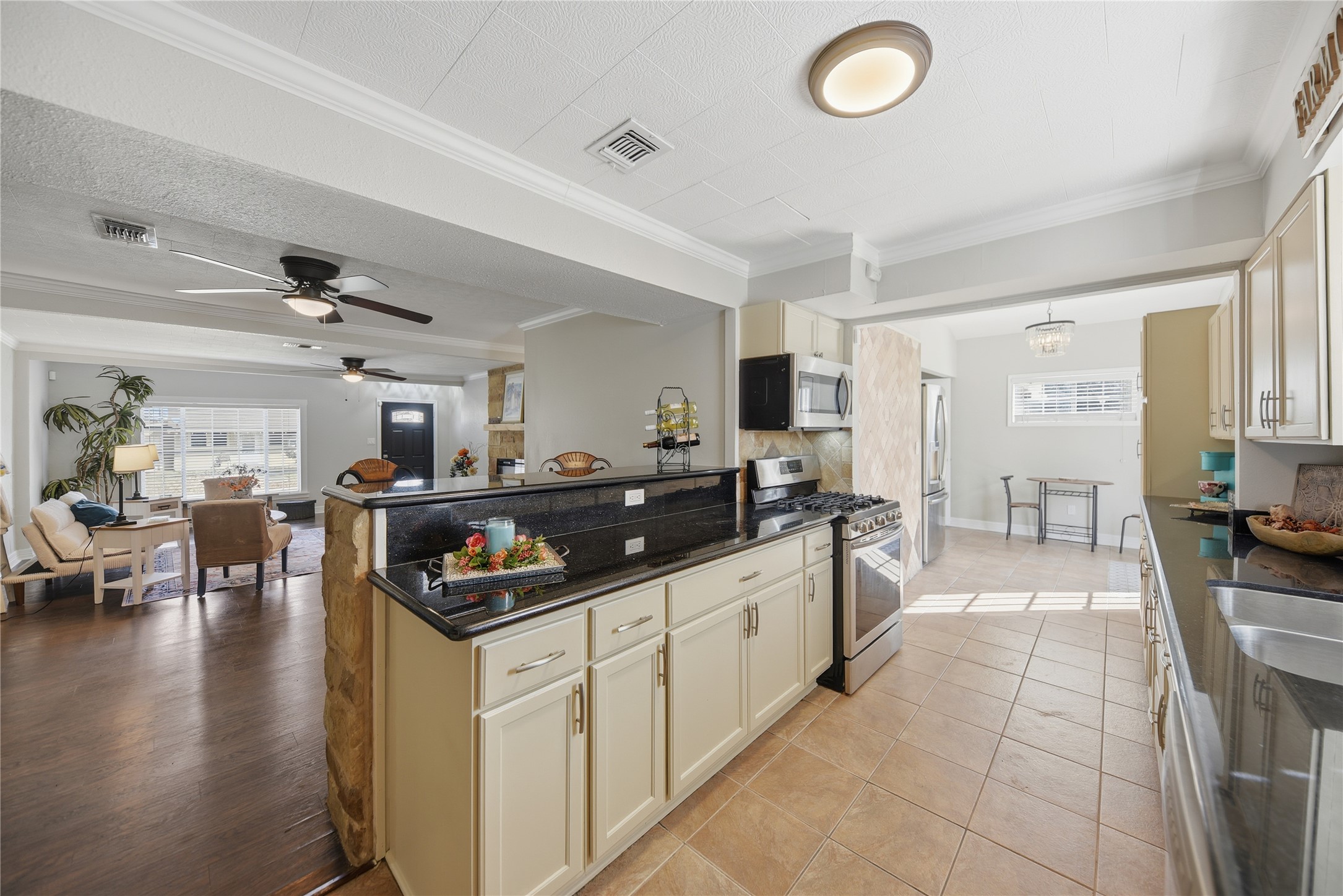 1702 Rampart Street Columbus, TX 78934 - Photo 38 of 38 a kitchen with stainless steel appliances granite countertop a sink and cabinets