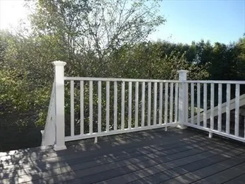 an aerial view of a house with a yard basket ball court and outdoor seating