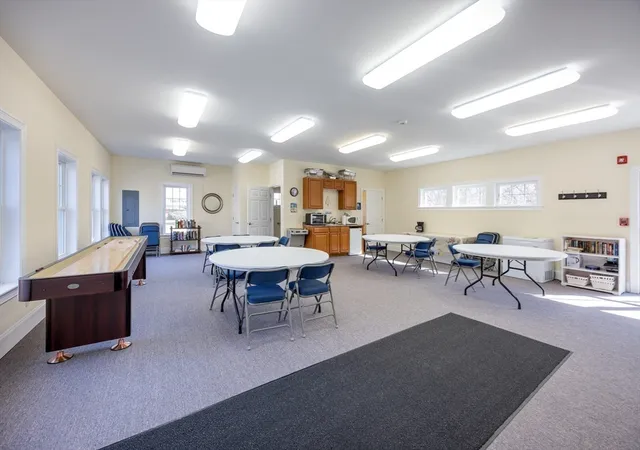 a view of a dining room with furniture and window