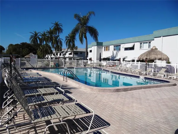 a view of a swimming pool with a patio