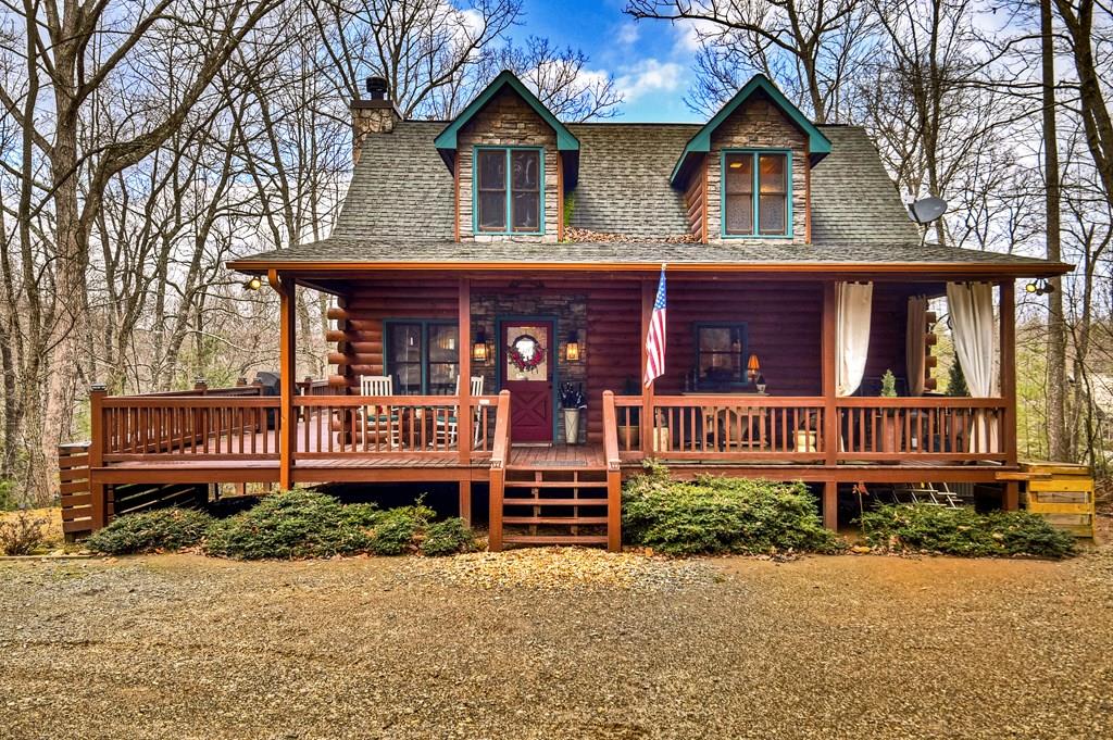 a view of a house with wooden fence