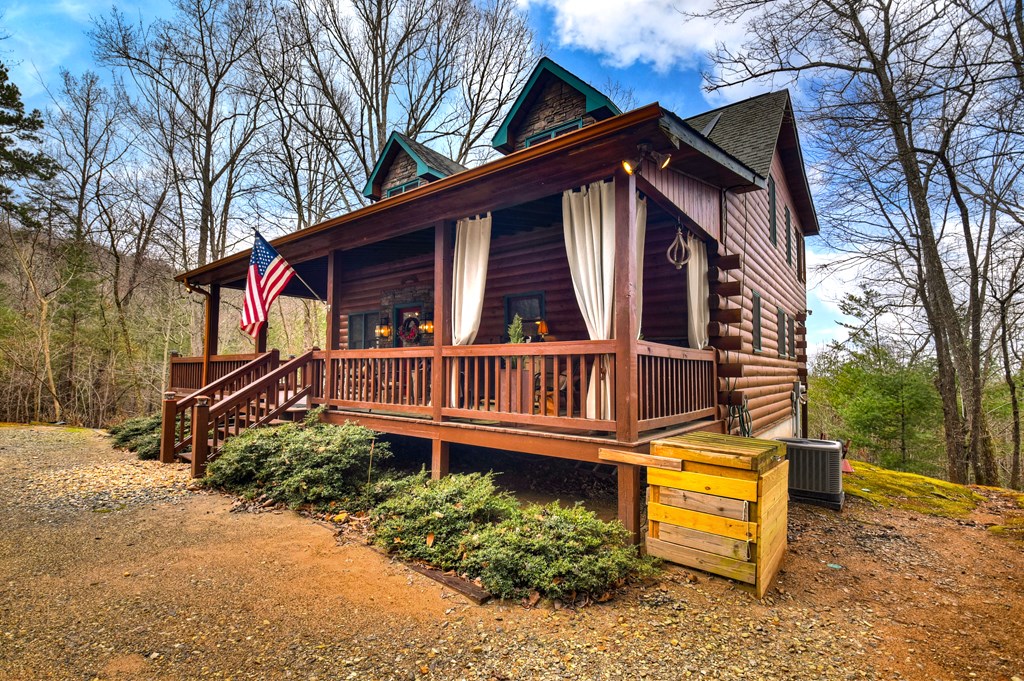 54 Channing Ridge Road Morganton, GA 30560 - Photo 18 of 54 a view of a house with a small yard and wooden fence