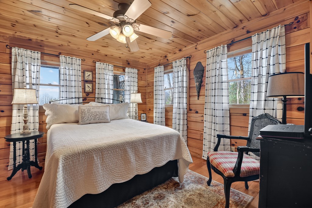 54 Channing Ridge Road Morganton, GA 30560 - Photo 35 of 54 a bed room with a bed and a chair