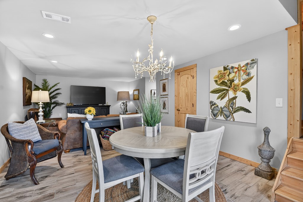 54 Channing Ridge Road Morganton, GA 30560 - Photo 38 of 54 a view of a dining room with furniture and wooden floor