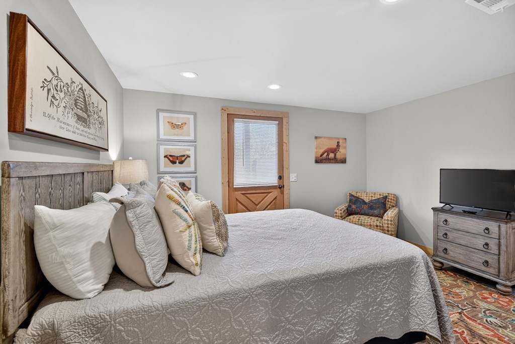 54 Channing Ridge Road Morganton, GA 30560 - Photo 45 of 54 a bedroom with a bed and a television