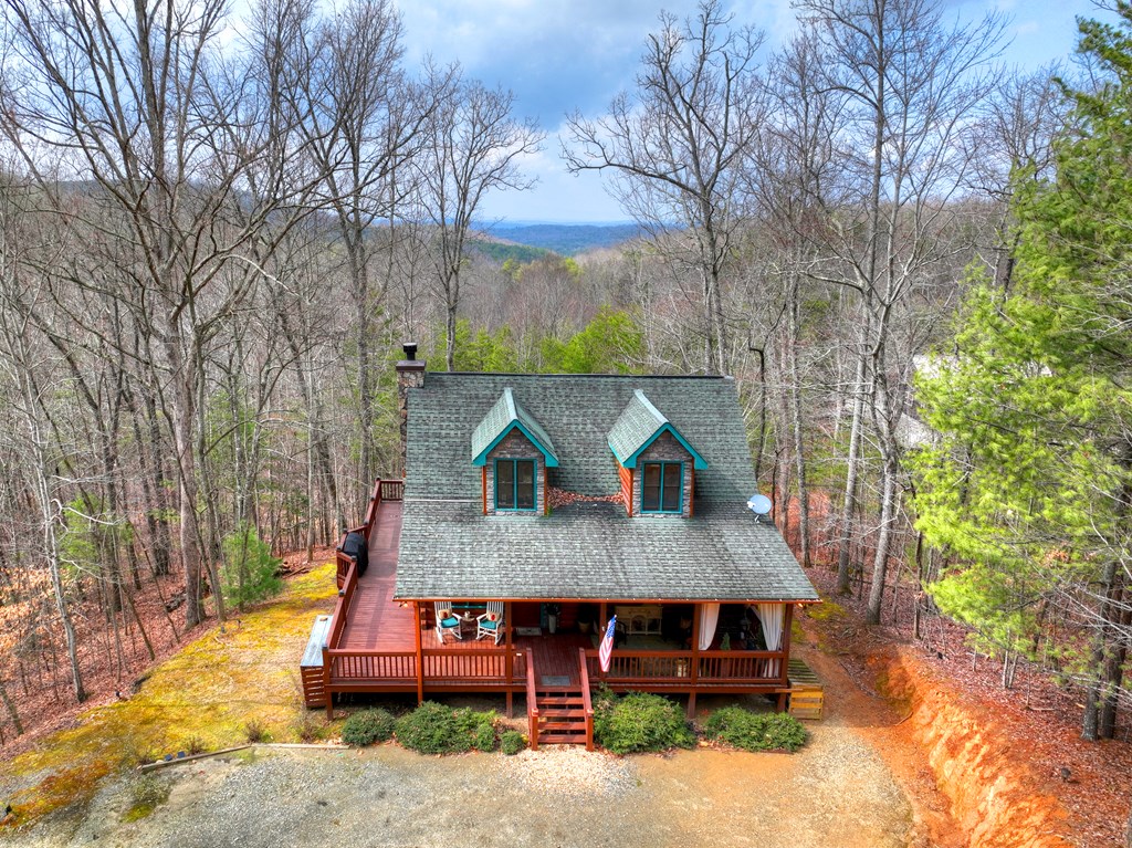 54 Channing Ridge Road Morganton, GA 30560 - Photo 9 of 54 a view of a wooden chairs and table on the wooden deck