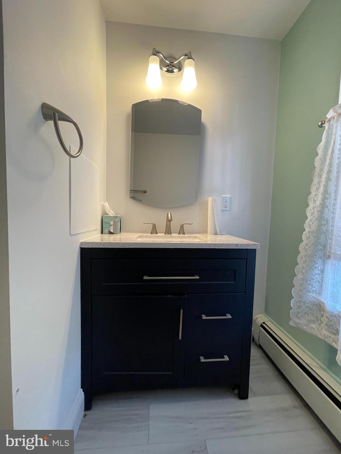 27 West High Street Hummelstown, PA 17036 - Photo 13 of 17 a bathroom with a sink and a mirror