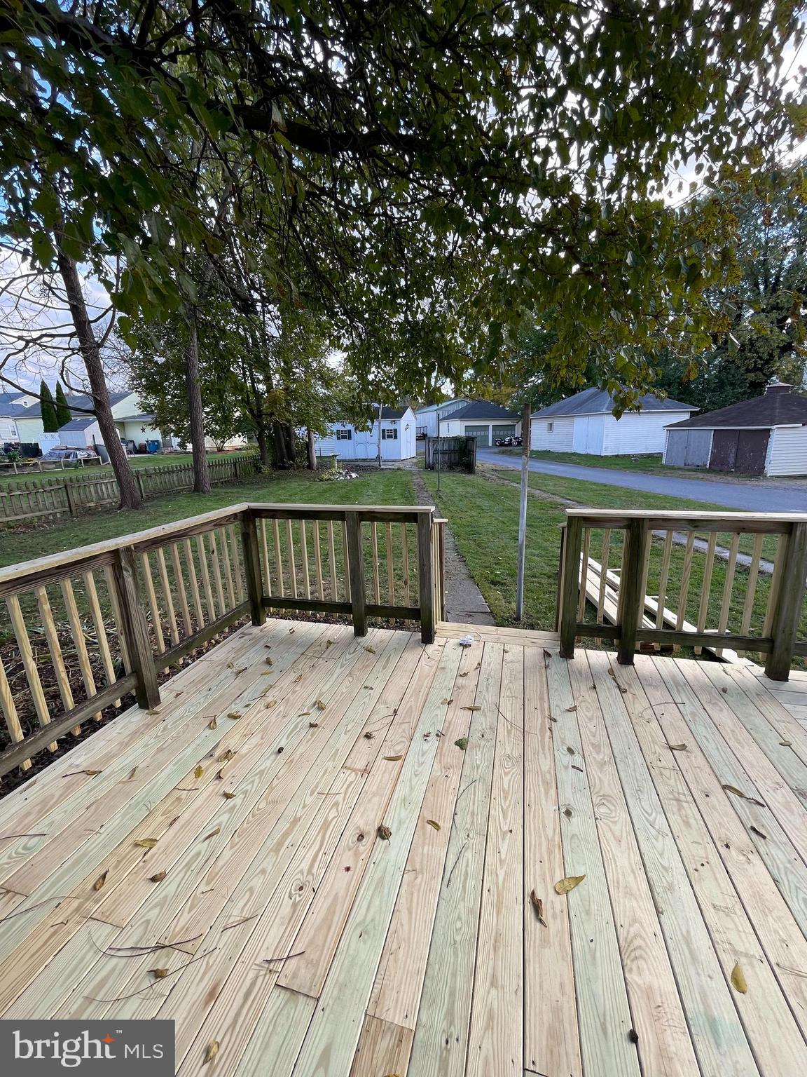 27 West High Street Hummelstown, PA 17036 - Photo 15 of 17 a view of a wooden deck with large trees