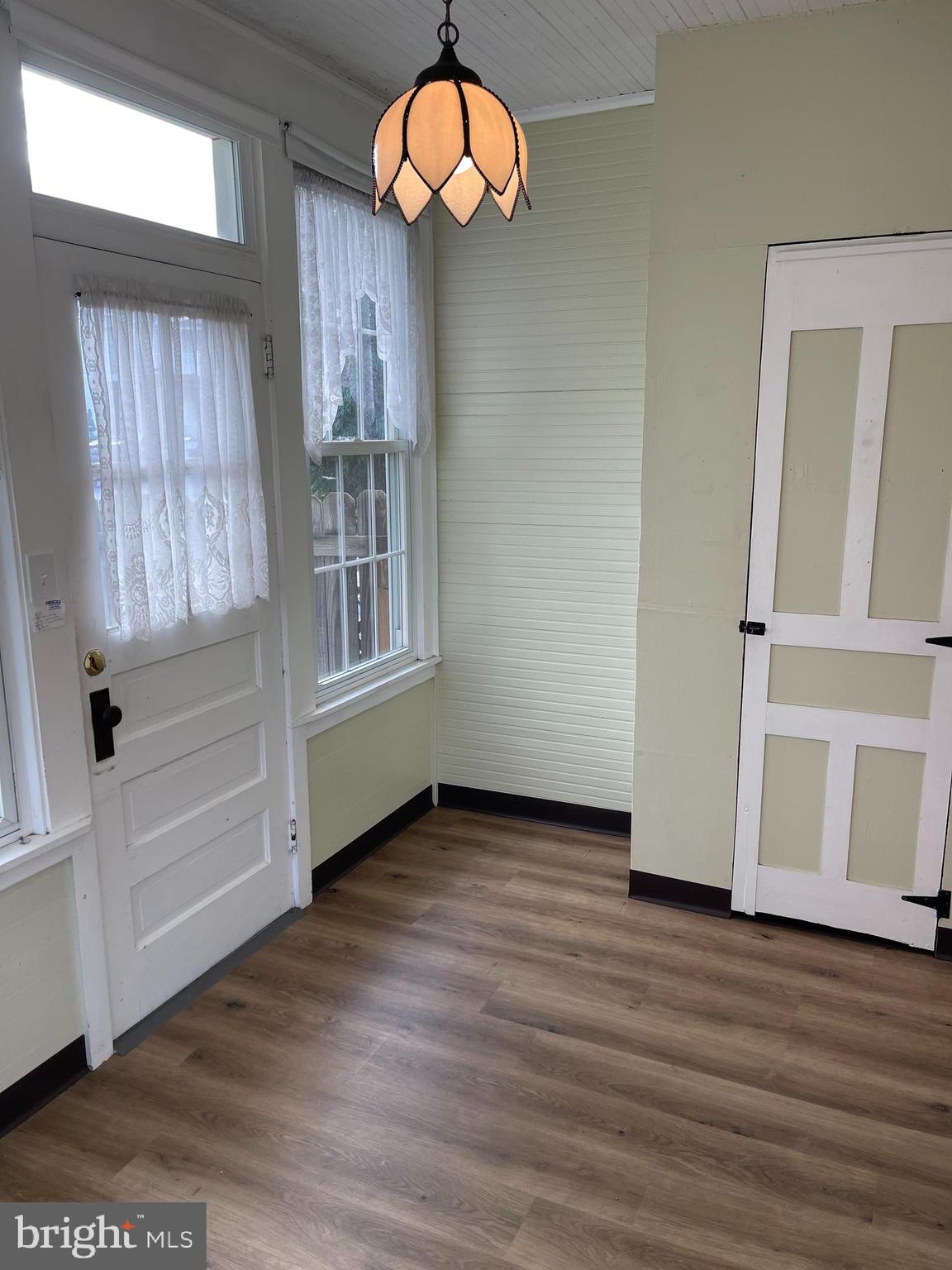 27 West High Street Hummelstown, PA 17036 - Photo 8 of 17 an empty room with wooden floor window and windows