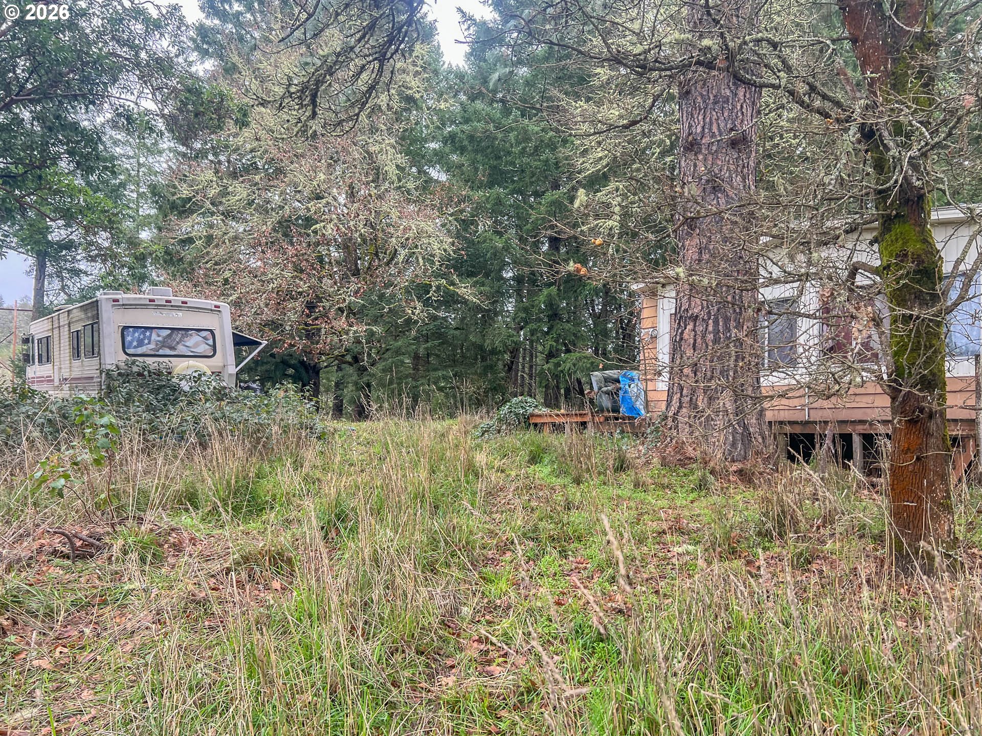 1698 Doerner Road Roseburg, OR 97471 - Photo 12 of 18 a backyard of a house with table and chairs