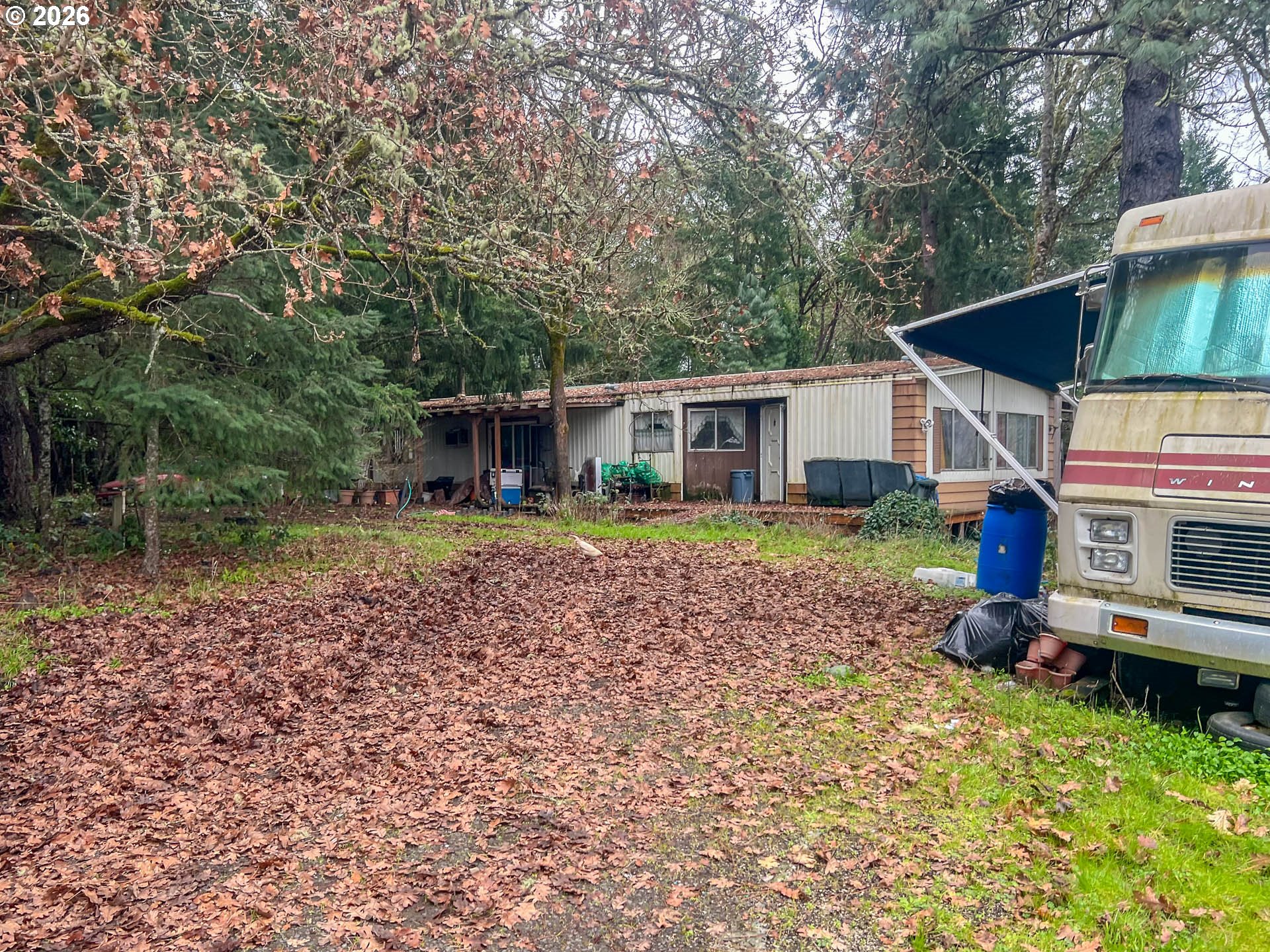 1698 Doerner Road Roseburg, OR 97471 - Photo 15 of 18 a front view of a house with garden