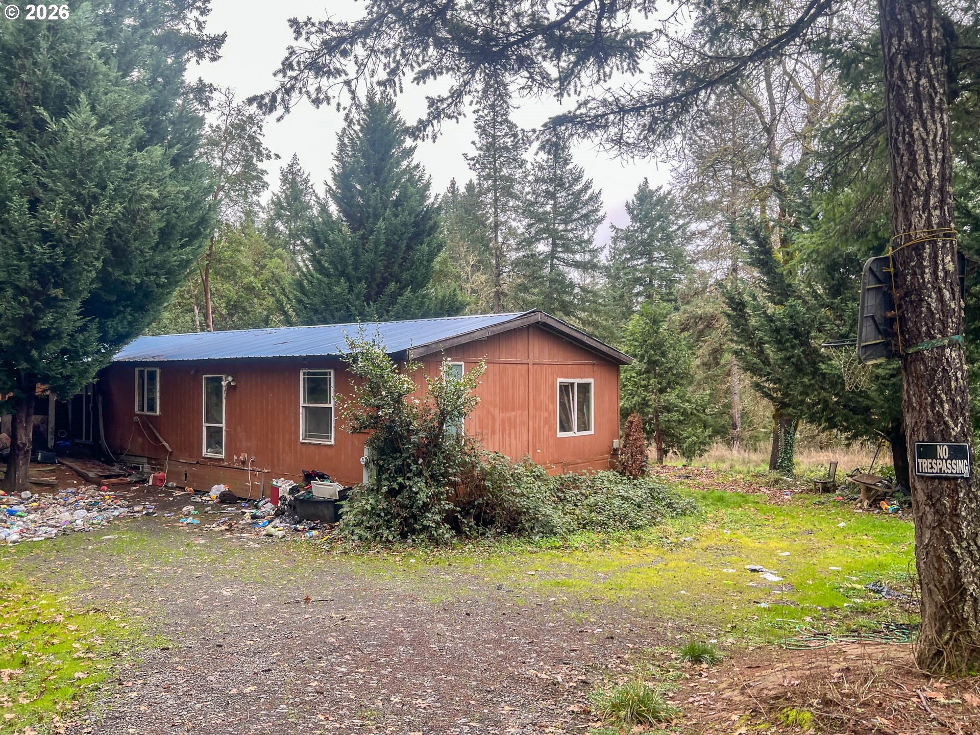 1698 Doerner Road Roseburg, OR 97471 - Photo 9 of 18 a front view of a house with garden