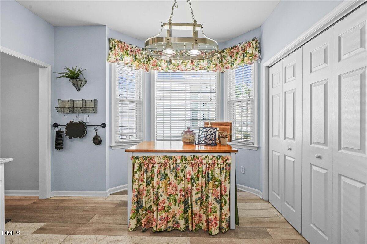3331 Swinford Court Raleigh, NC 27604 - Photo 14 of 27 a view of entryway with chandelier and front door