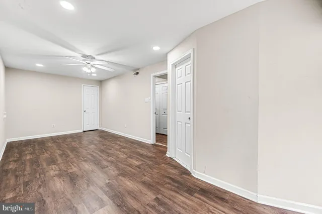 a view of a patio with a table and chairs under an umbrella