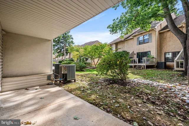 a view of front of house with large windows