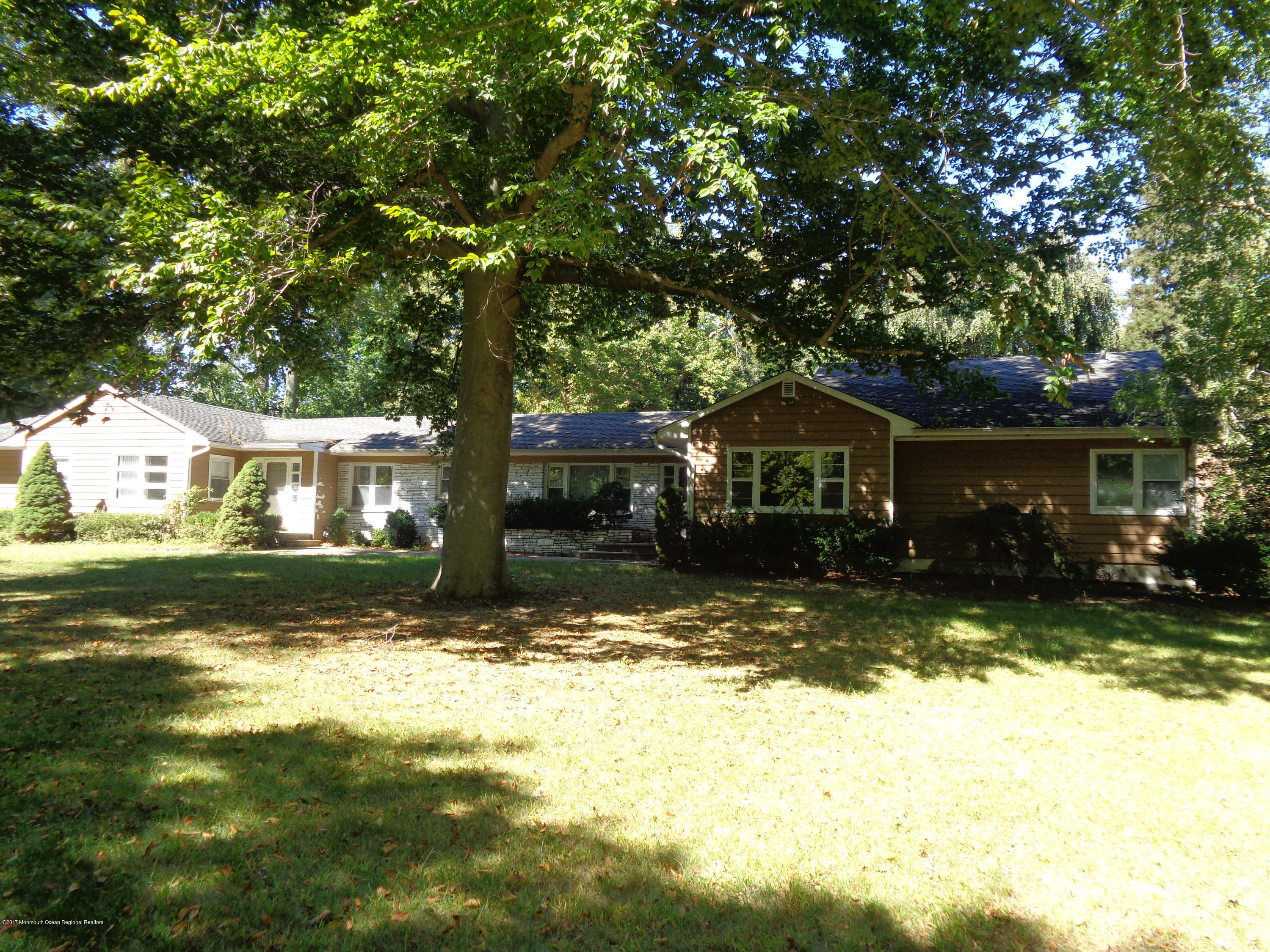 84 Rumson Road Rumson, NJ 07760 - Photo 2 of 5 a front view of a house with a yard