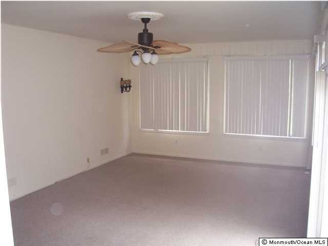 84 Rumson Road Rumson, NJ 07760 - Photo 3 of 5 a view of an empty room with a window
