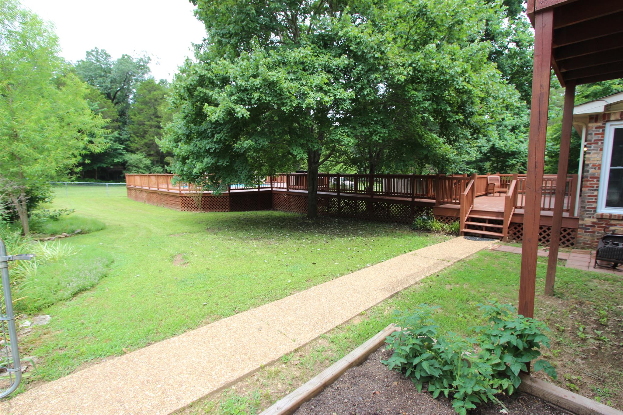 954 Beasleys Bend Road Lebanon, TN 37087 - Photo 6 of 28 a view of a backyard with a garden and sitting area