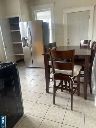 a kitchen with a table and chairs
