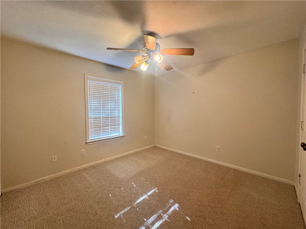 1204 Bayou Woods Drive College Station, TX 77840 - Photo 13 of 14 a view of an empty room with a window