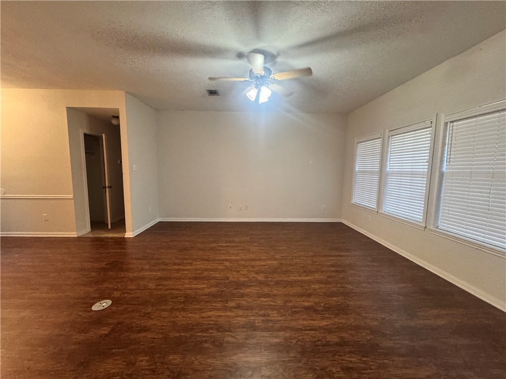 1204 Bayou Woods Drive College Station, TX 77840 - Photo 3 of 14 wooden floor in an empty room with a window