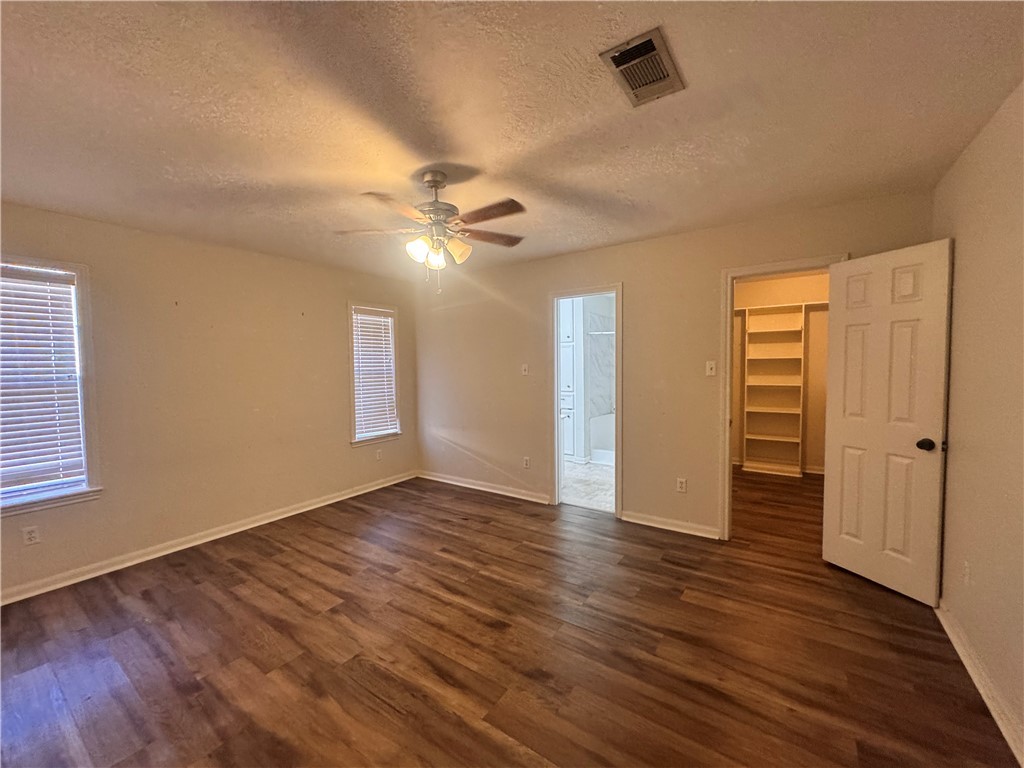 1204 Bayou Woods Drive College Station, TX 77840 - Photo 9 of 14 wooden floor in an empty room with a window