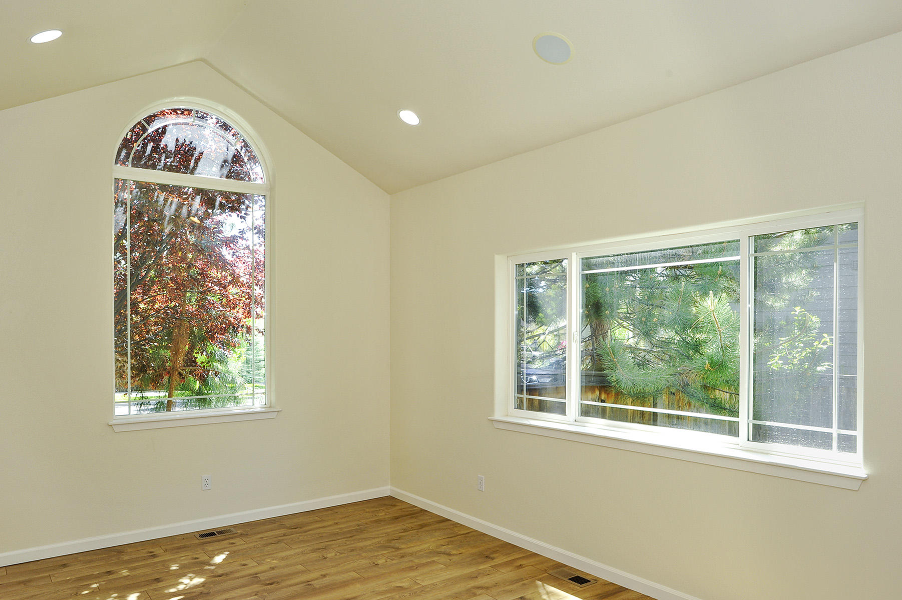 19834 Powers Road Bend, OR 97702 - Photo 3 of 22 Large main floor office or bonus space off entry with vaulted ceiling, picture windows, speaker system & french doors.