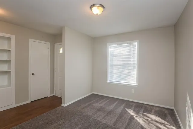 a view of an empty room and window