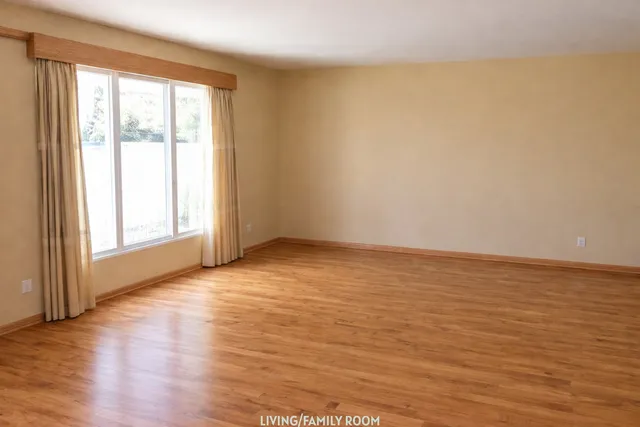 a view of an ocean & mountain view from a big room