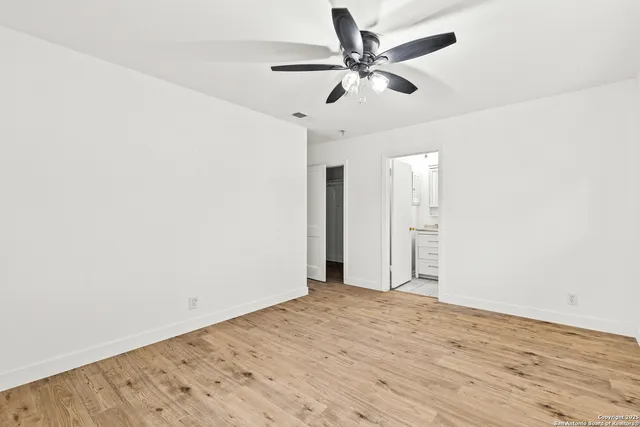 a bathroom with a toilet sink and shower