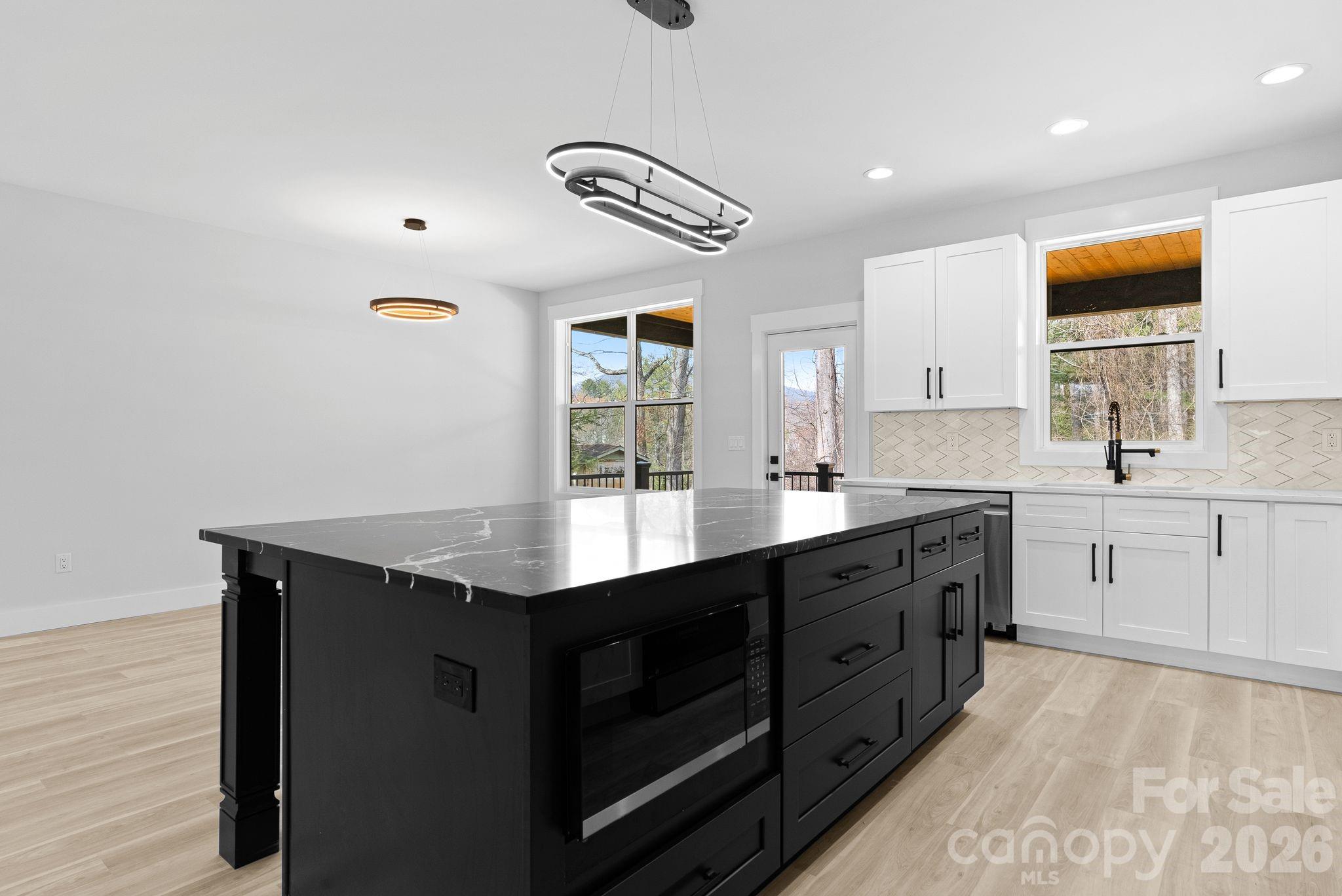 19 East Starnes Cove Road Asheville, NC 28806 - Photo 15 of 46 a kitchen with a sink appliances and cabinets