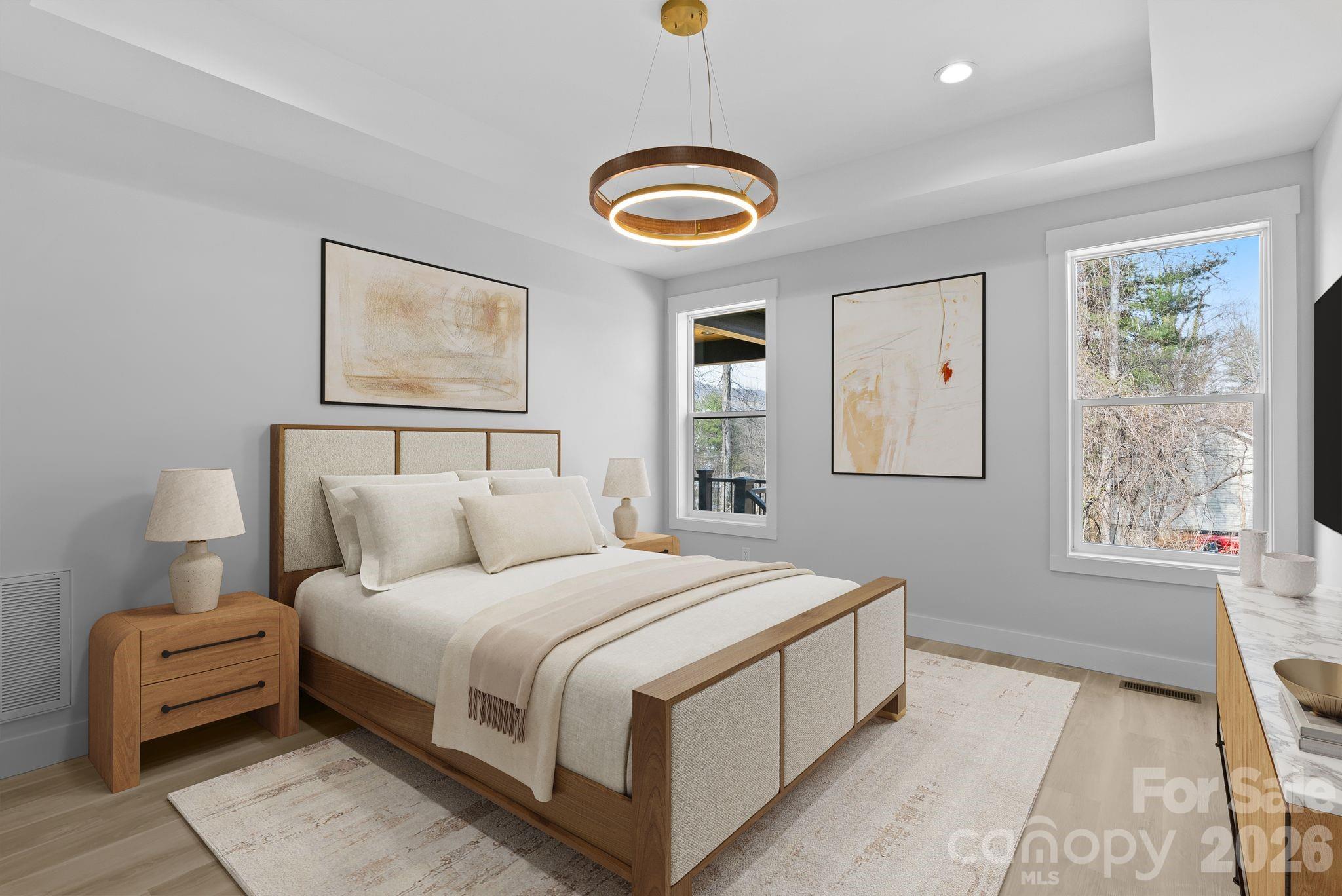 19 East Starnes Cove Road Asheville, NC 28806 - Photo 17 of 46 a bedroom with a bed and a window