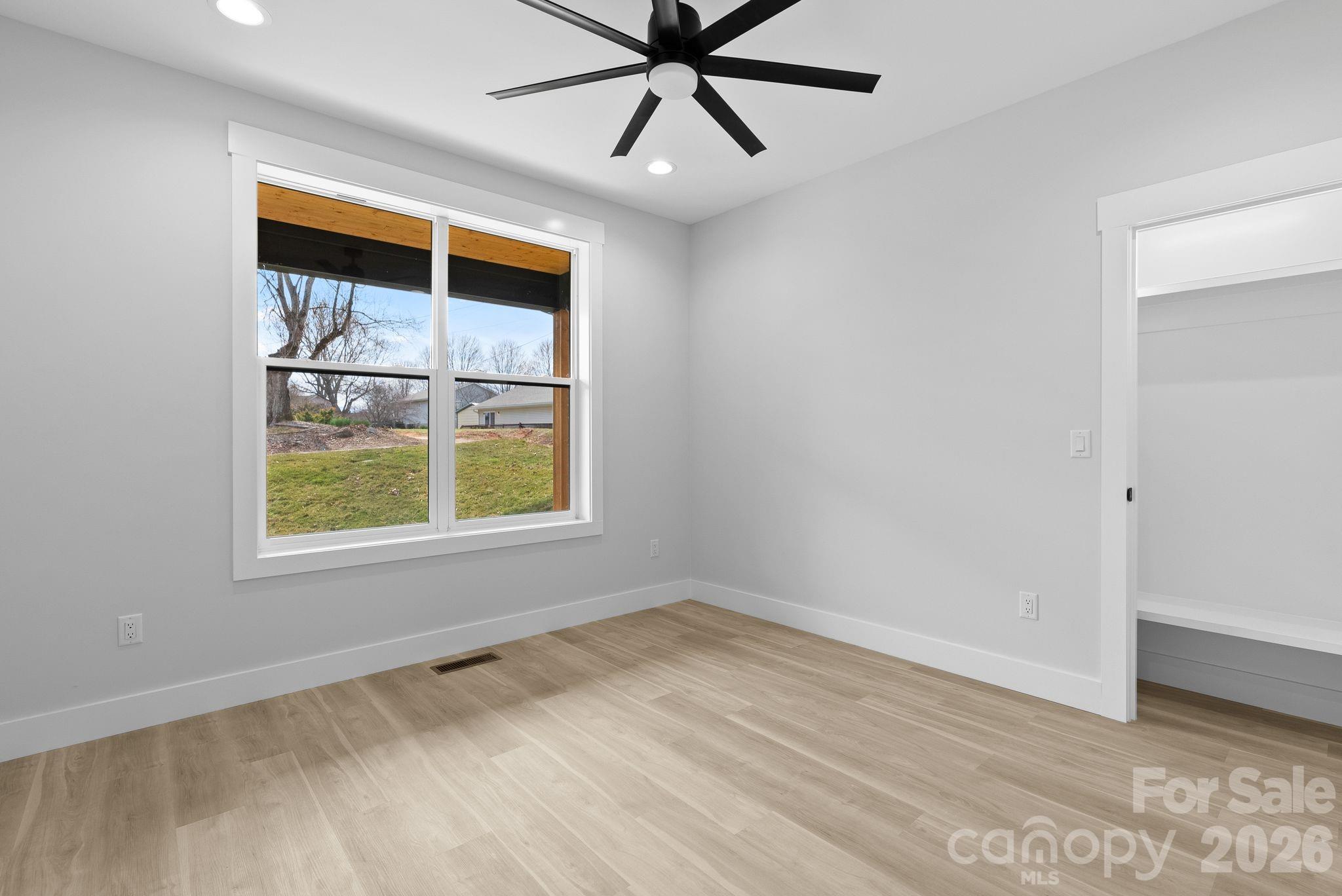 19 East Starnes Cove Road Asheville, NC 28806 - Photo 29 of 46 a view of an empty room and window