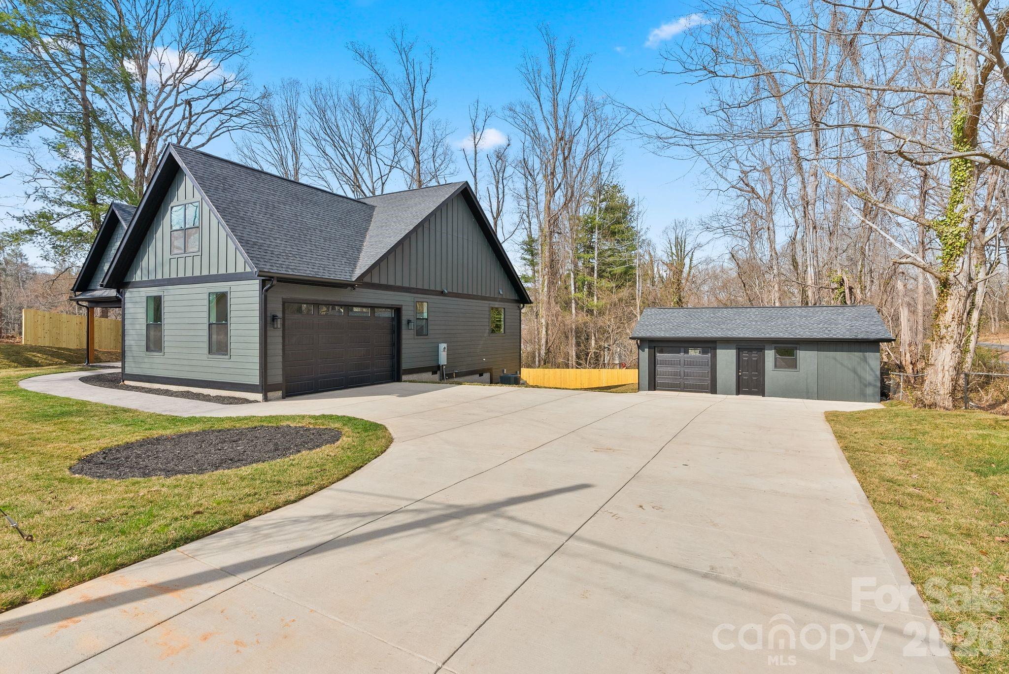 19 East Starnes Cove Road Asheville, NC 28806 - Photo 3 of 46 a view of house with outdoor space and sitting area